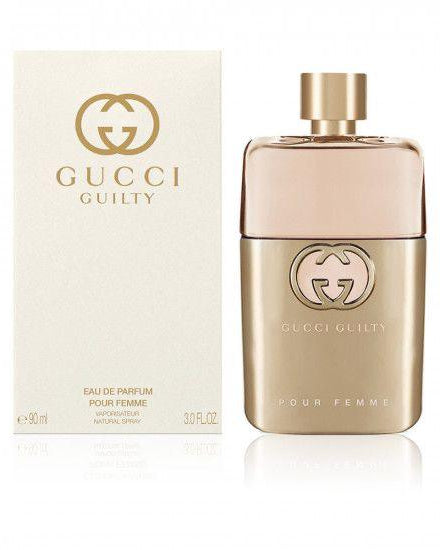 Gucci Guilty perfume bottle and packaging on a white background
